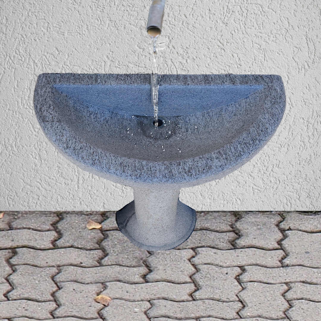 Wall fountain in ancient granite